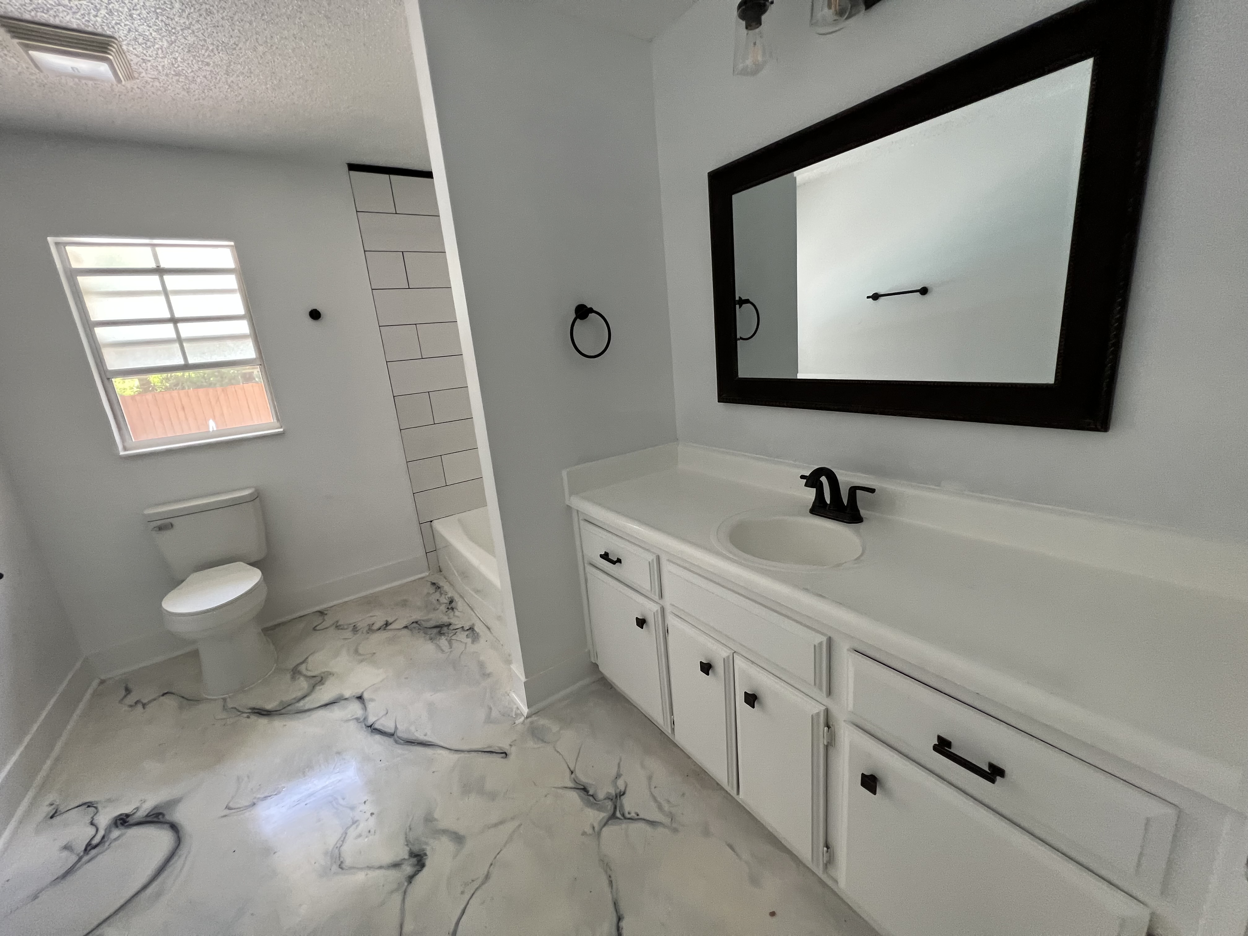 Hand-poured epoxy marble flooring — artisan bespoke finish
