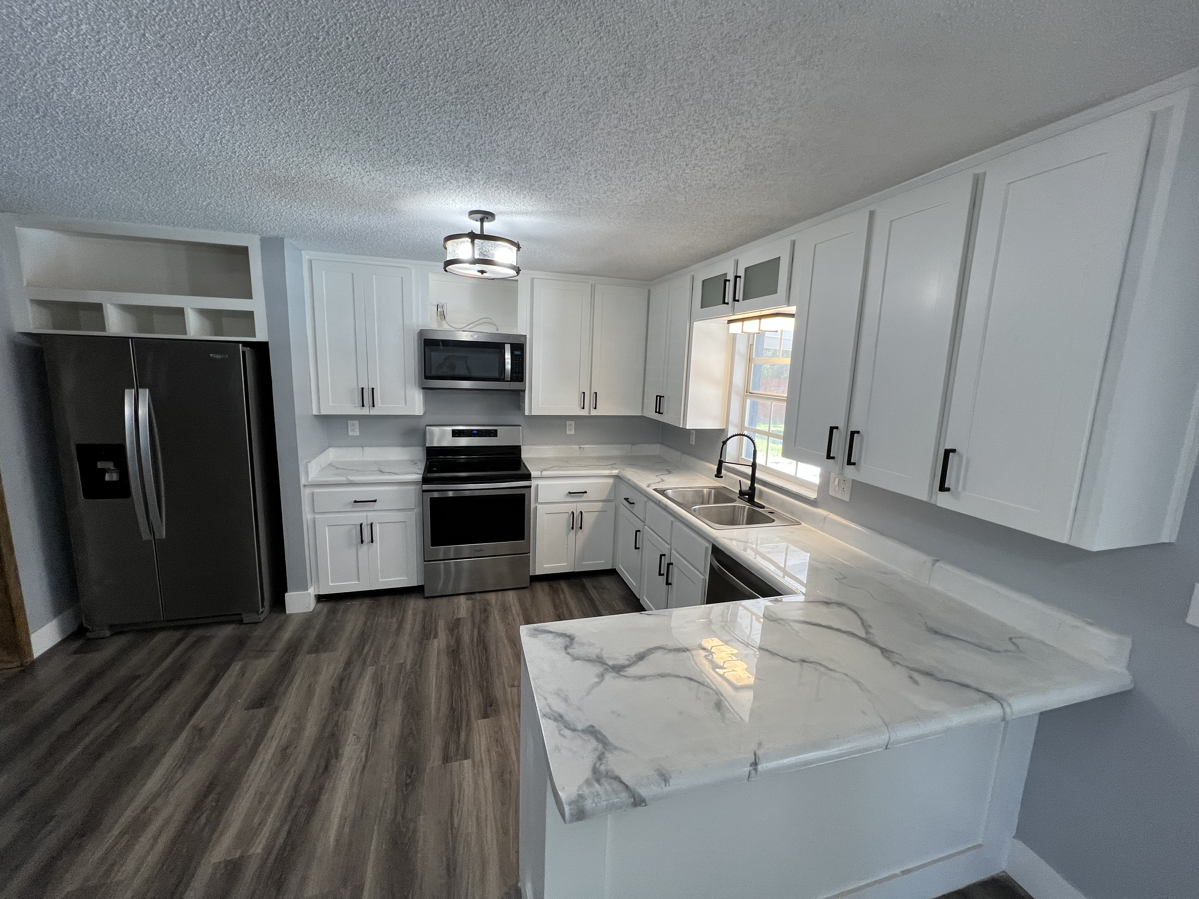 Custom kitchen renovation with Calacatta quartz and shaker cabinetry